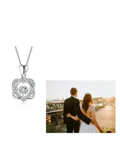 Detail of S925 sterling silver necklace with double heart pendant and moissanite stone