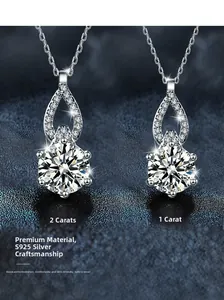 Detail of 1ct and 2ct moissanite S925 sterling silver pendants with teardrop halo design