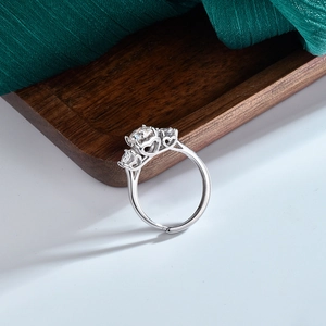 Three-stone S925 sterling silver ring with moissanite and hollow heart side details