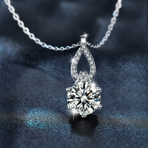 Moissanite S925 sterling silver necklace with a six-prong round pendant on blue silk