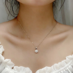 Elegant S925 silver moissanite perfume bottle necklace worn by a model on white blouse