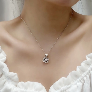 S925 sterling silver necklace with sparkling rose flower pendant worn by a model
