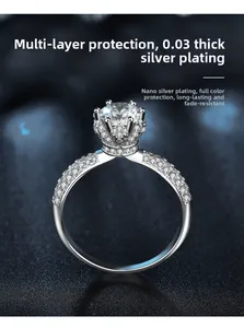 Macro view of crown-shaped 925 silver ring with 1ct stone and pavé setting details