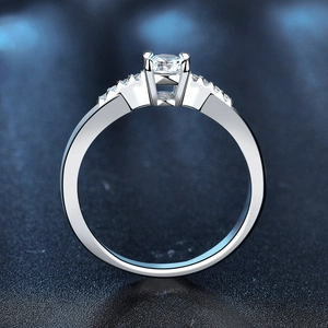 Elegant 925 sterling silver moissanite ring with polished finish and side stone accents