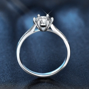Classic six-prong 925 silver crown ring with round moissanite and side stones