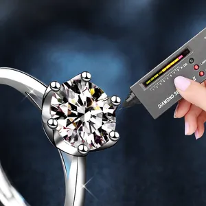 Adjustable 925 sterling silver moissanite ring with six-prong setting and diamond tester tool