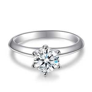 Classic six-prong moissanite engagement ring in 925 sterling silver on white background