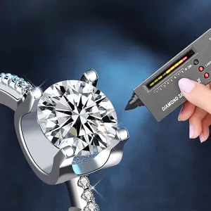 925 sterling silver moissanite ring with classic four-prong setting tested by diamond pen