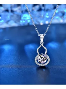 Close-up of 925 silver gourd pendant with 3EX cut moissanite showing eight hearts and arrows
