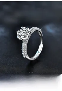 Macro view of the 925 sterling silver lotus ring featuring a sparkling moissanite diamond