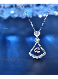 Detailed view of 925 silver fan pendant with a dancing moissanite stone and 3EX cut quality