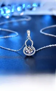Macro shot of 925 silver gourd pendant featuring a sparkling moissanite center stone