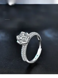Macro view of 3EX cut moissanite ring with six-prong setting and pavé side stones