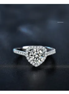 Macro view of a 925 silver heart halo ring featuring brilliant moissanite accents