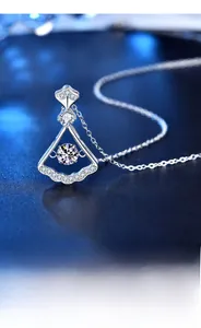 Macro shot of 925 sterling silver fan pendant with moissanite center stone and pavé accents