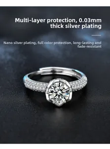 Macro shot of 925 silver six-prong moissanite ring with pave diamond band detail