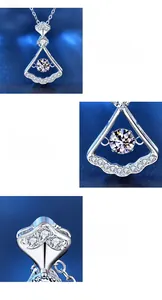 Macro detail of 925 silver fan pendant with four-prong moissanite setting and polished finish
