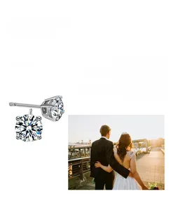 Detailed view of six-prong moissanite sterling silver stud earrings with romantic imagery