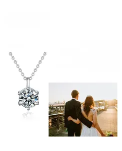 Detailed close-up of a Moissanite silver necklace with a six-prong solitaire pendant