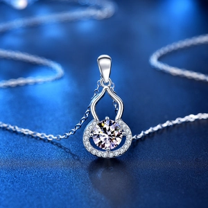 Gourd-shaped S925 silver necklace with round moissanite pendant on blue background