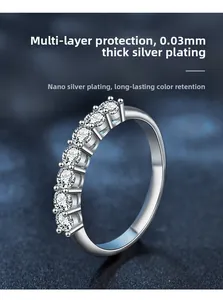Detail of 0.03mm silver plated ring showing seven prong-set round white stones