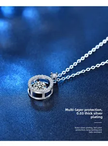 Macro view of sterling silver heart pendant with shimmering center stone and nanoplating