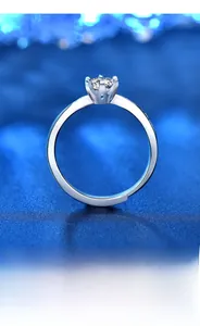 Detail of moissanite ring showing 925 silver six-prong setting and adjustable band