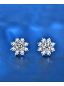 Macro shot of 925 silver sunflower studs showing 3EX heart and arrow moissanite cut