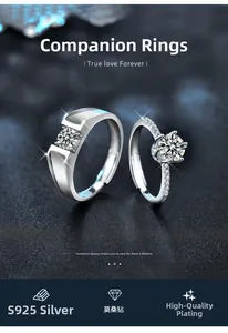 Detaillierte Nahaufnahme von 925 Sterling Silber Partnerringen mit Moissanit auf dunklem Grund