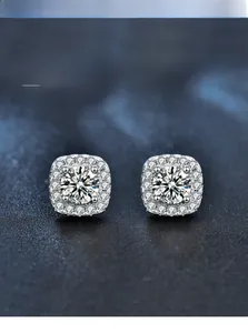 Macro detail of square halo stud earrings with 3EX cut moissanite in 925 silver setting