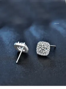 Detail of halo setting silver stud earrings with moissanite and nano-plating finish