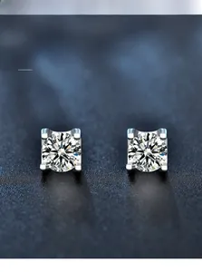 Detailed view of 3EX round cut moissanite stud earrings with 58 facets and heart-and-arrow effect