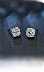 Macro shot of 925 sterling silver square halo stud earrings with brilliant cut moissanite stones