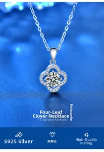 Macro detail of silver four-leaf clover necklace pendant with moissanite center stone