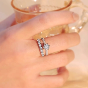 Elegant S925 sterling silver moissanite ring set with classic six-prong solitaire and band
