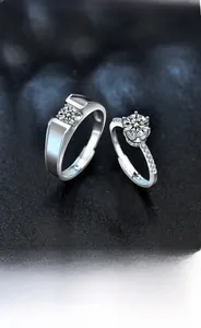 Makroaufnahme von 925 Sterling Silber Partnerringen mit Moissanit-Diamant und offenem Band