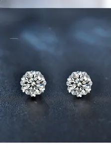 Macro detail of snowflake stud earring featuring 3EX cut moissanite with 58 facets
