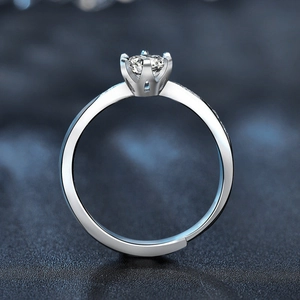 Elegant six-prong moissanite ring in 925 sterling silver with adjustable band and side stones