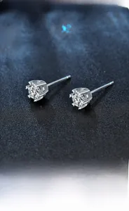 Detail of 925 sterling silver six-prong moissanite stud earrings with snowflake sparkle