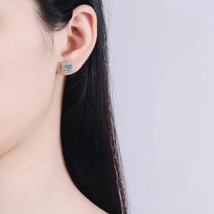 Minimalist square moissanite stud earrings in 925 sterling silver on a female model
