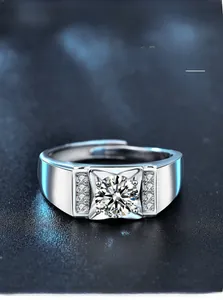 Macro detail of men's silver ring showing multi-layer plating and brilliant round moissanite