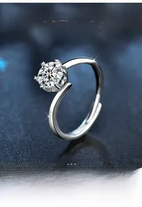 Macro shot of 925 silver twist band ring with a sparkling six-prong moissanite stone