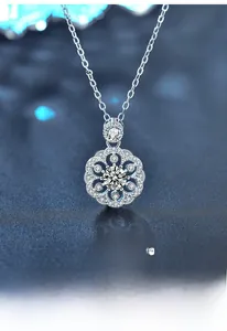 Macro shot of 925 silver cherry blossom pendant featuring moissanite and fine plating
