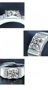 Macro detail of men's silver ring showing 4-prong moissanite setting and side accent stones