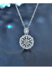 Macro detail of 925 sterling silver cherry blossom pendant with 3EX cut moissanite
