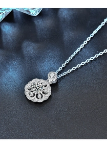 Macro shot of 925 silver cherry blossom necklace with moissanite and pave stones