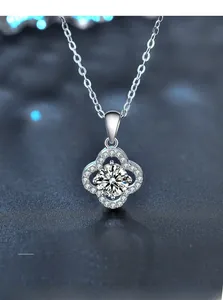 Detail of S925 silver clover pendant with 3EX cut moissanite and 58 sparkling facets