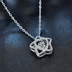 S925 sterling silver star necklace with a dancing moissanite stone on starry background