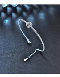 Detail showing 925 sterling silver adjustable bracelet with moissanite center stone halo
