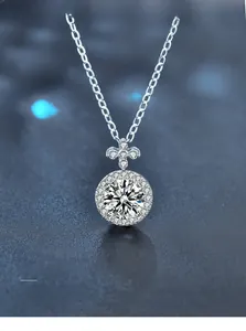 Macro detail of Moissanite clover pendant featuring 3EX cut and eight hearts and arrows